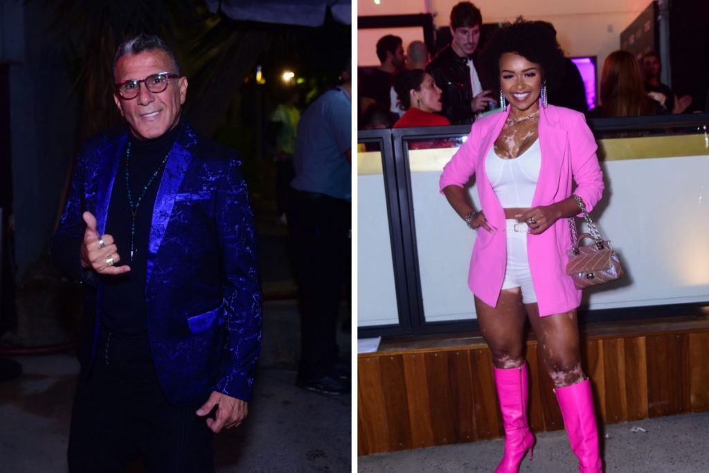 Eri Johnson de casaco azul brilhante e Natália Deodato de rosa-neon